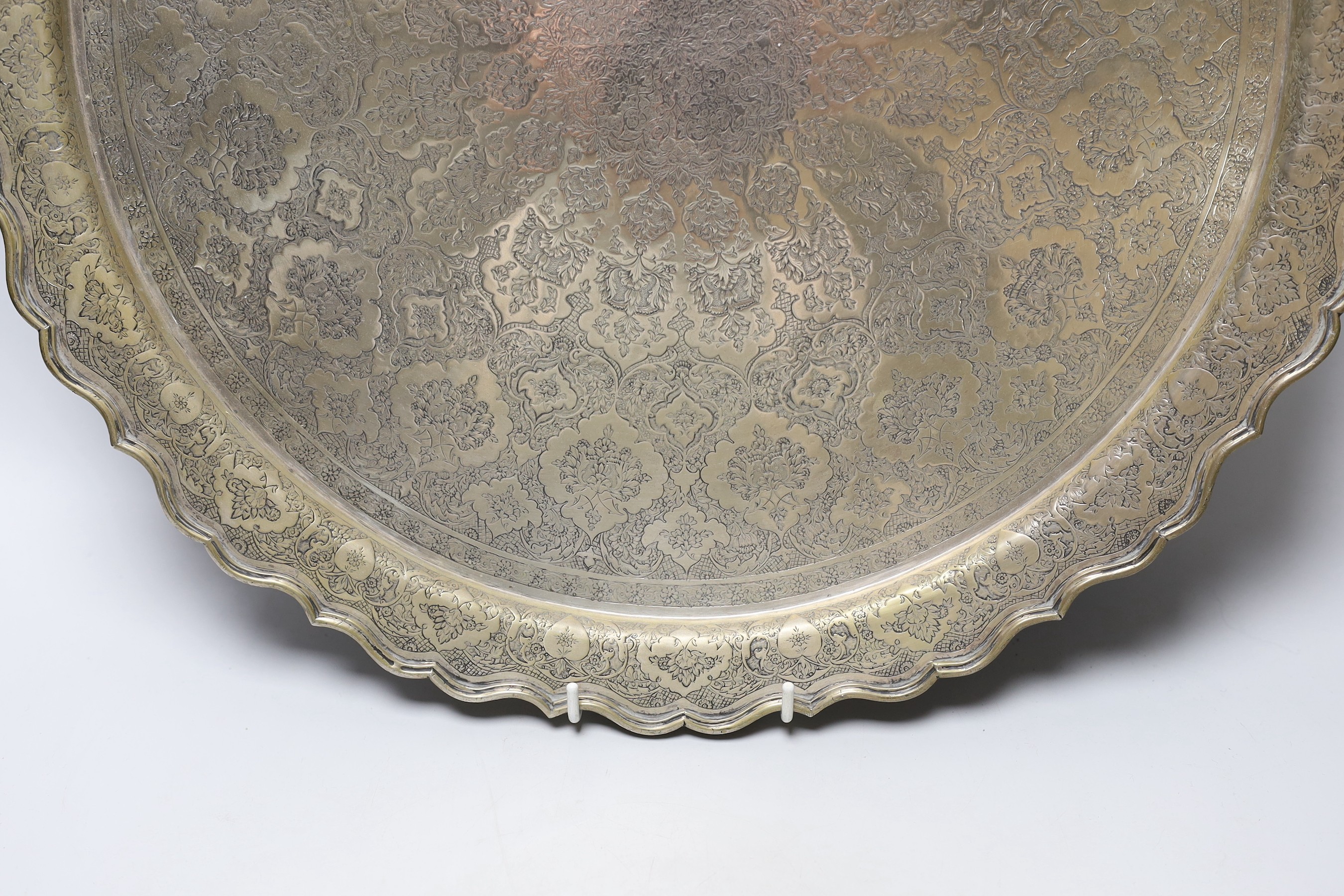 A Persian engraved white metal tray, 43.7cm, 49oz.